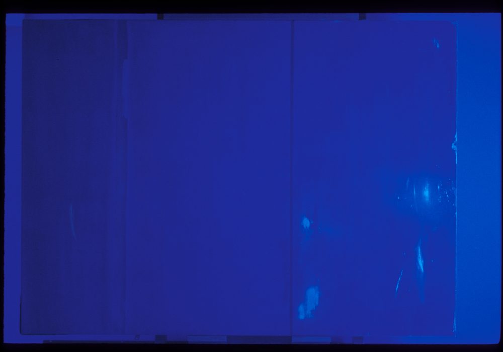 The same painting recorded under ultraviolet light, revealing surface differences