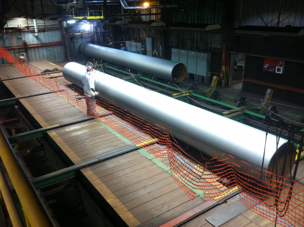 Pipe laid out on a table for inspection