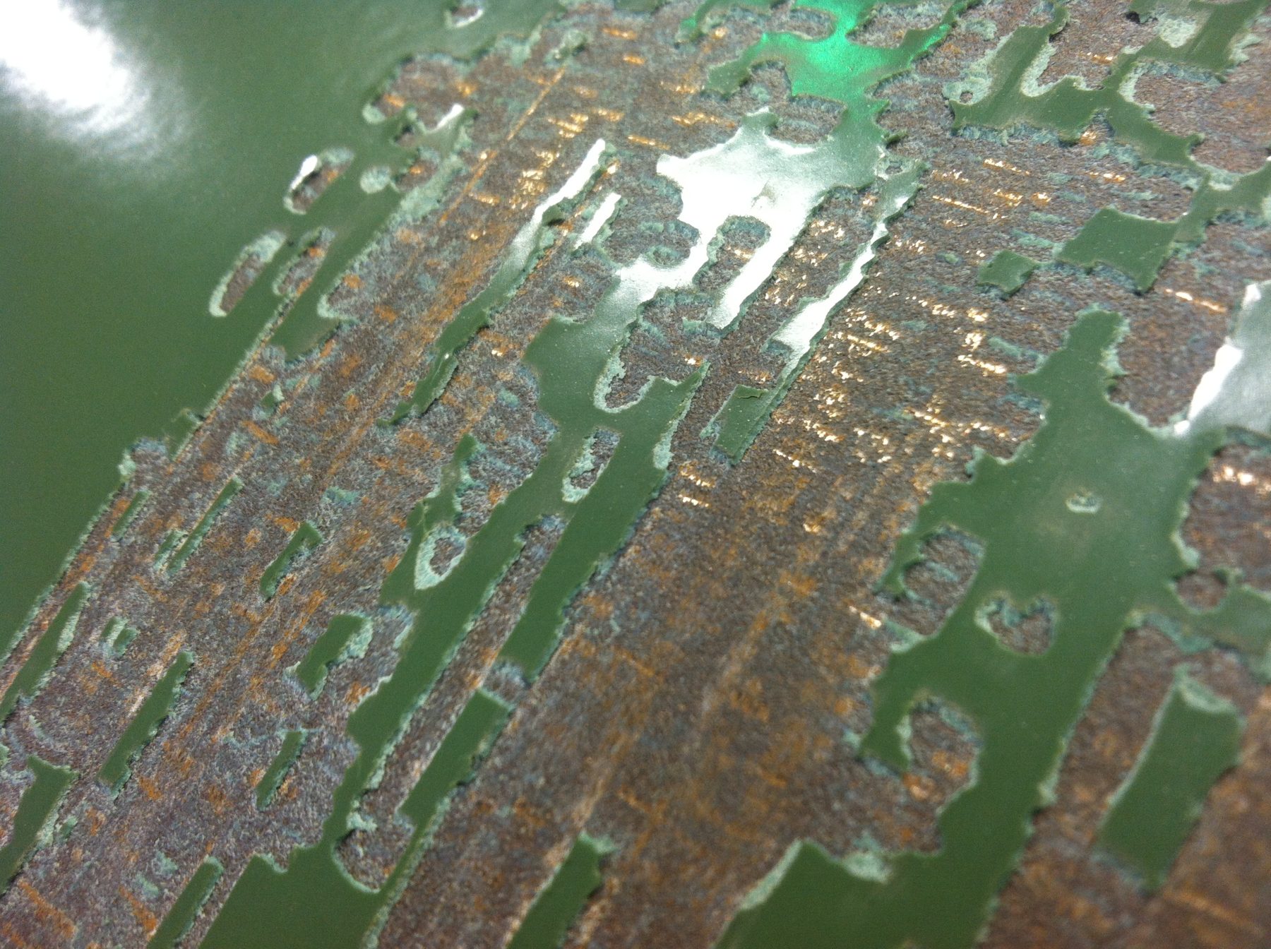 Coating inspection under way on pipe at a coating facility