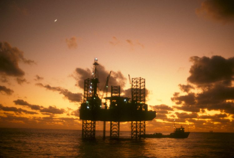 Offshore platform silhouetted at dusk