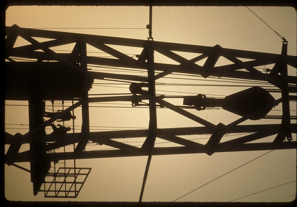 Structural steelwork silhouetted against sky